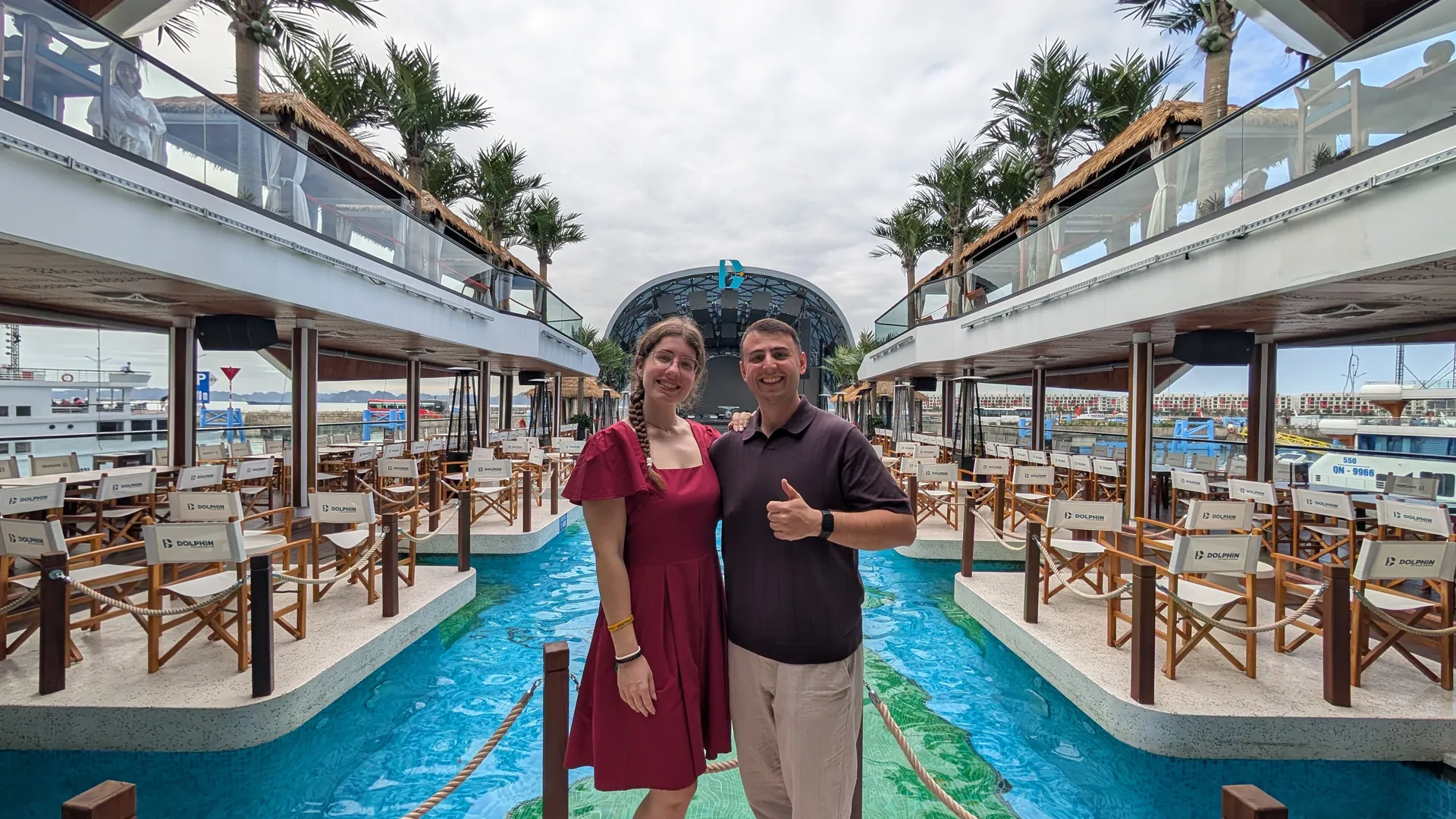 Liam and Sarah standing in the middle of the pool deck on the Dolphin day cruise in Ha Long Bay