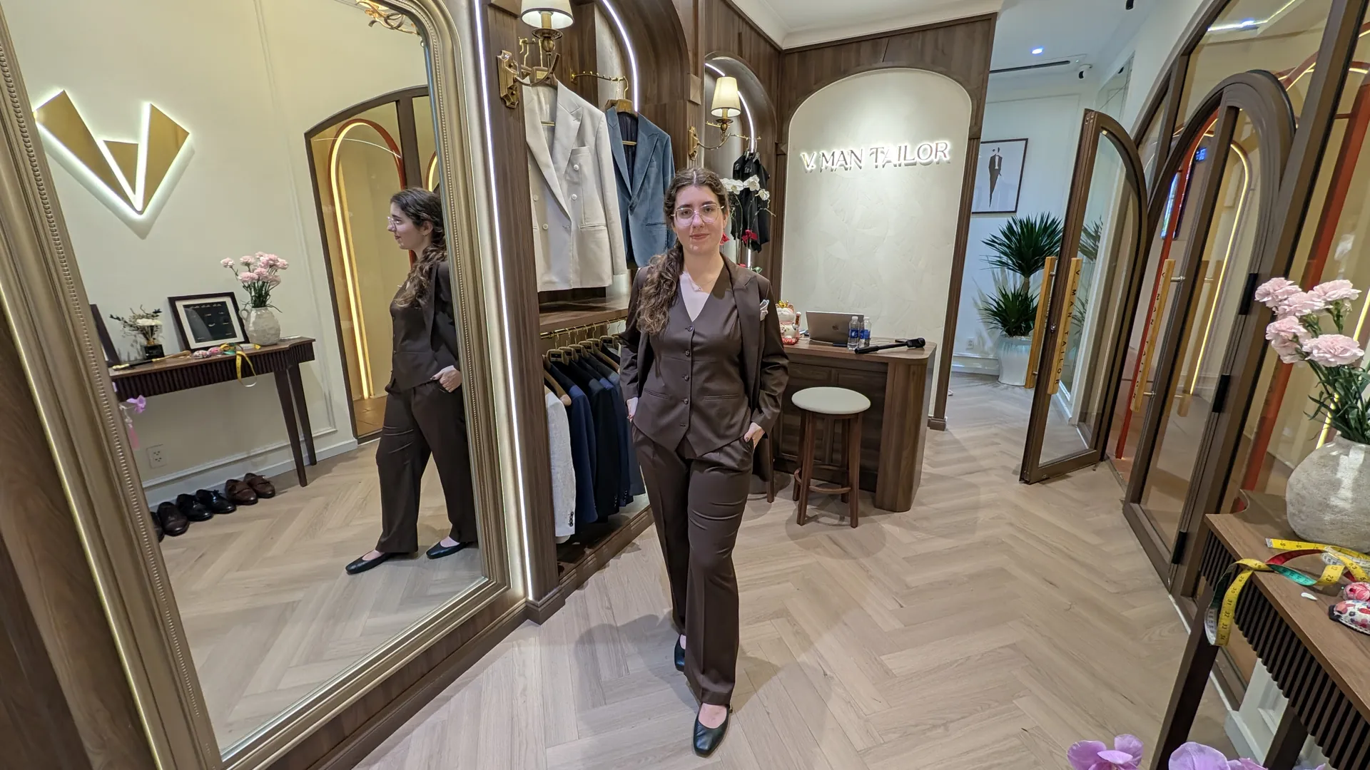Sarah in her brown three-piece suit inside VMan Tailor in Ho Chi Minh City